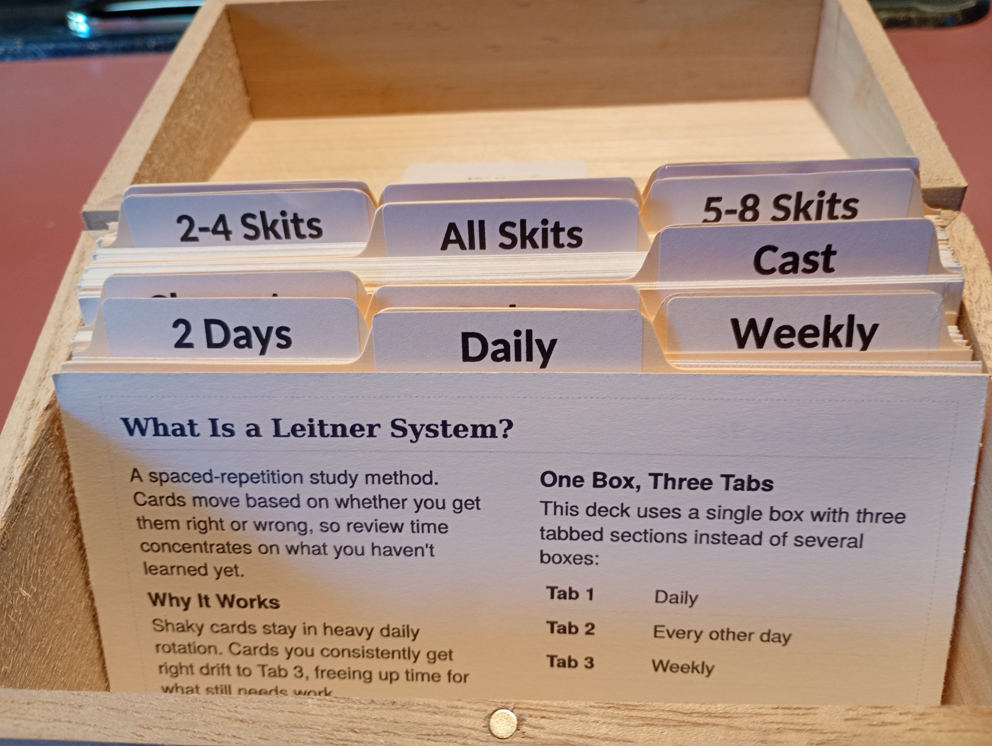 Study cards organized in a wooden box under Daily, 2 Days, Weekly and skit tabs