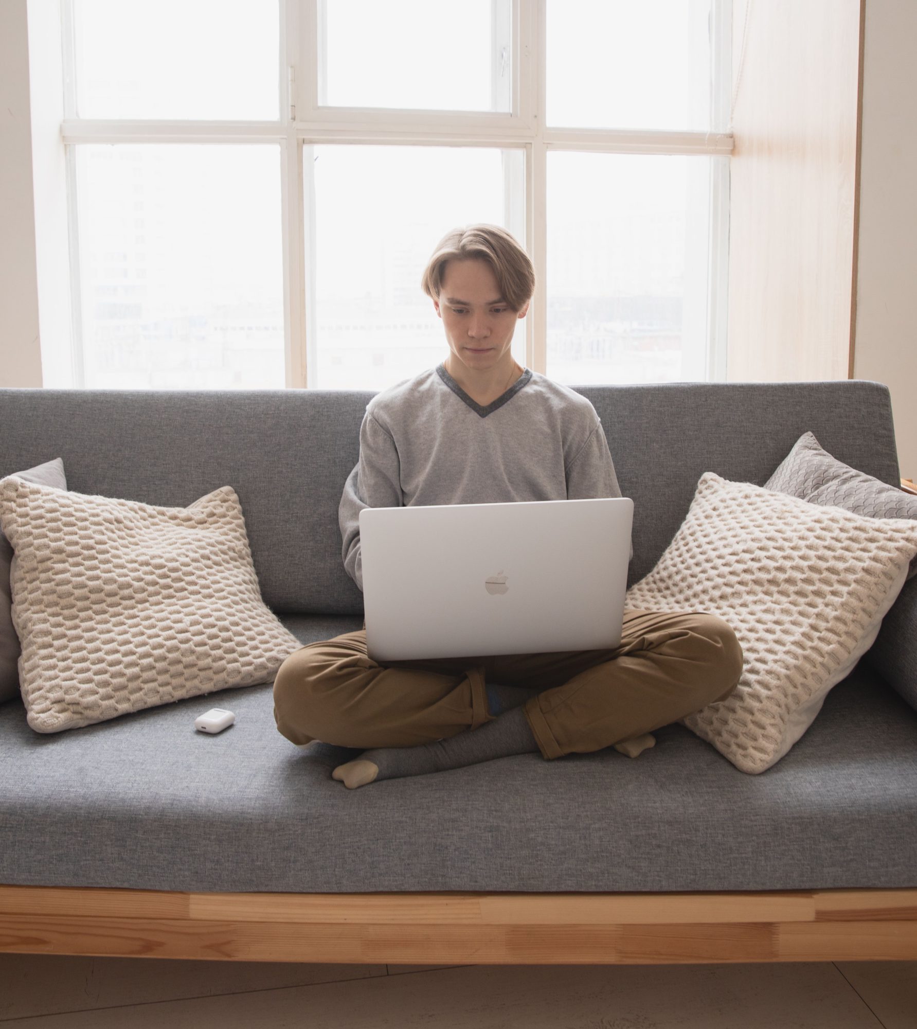 person sitting with laptop in front of them
