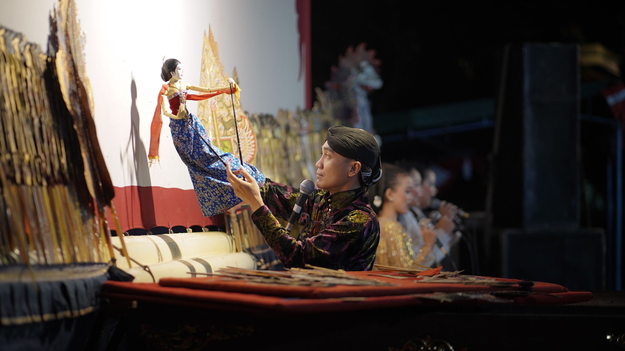 Person in studio working with puppets